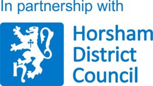 The Horsham District Council logo with the words "In partnership with Horsham District Council" written in blue.