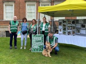 Members of the Friends of Horsham Park's committee beside their charity stall