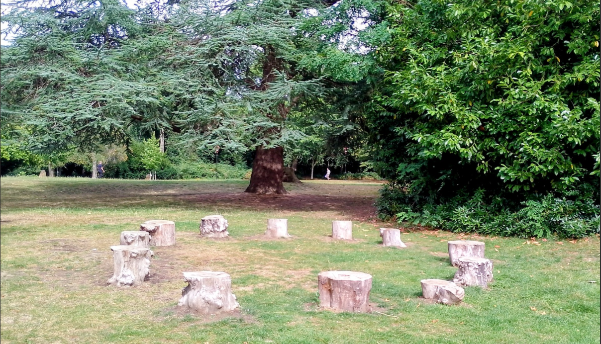A ring of tree roundels for seating in the Poets Corner of Horsham Park